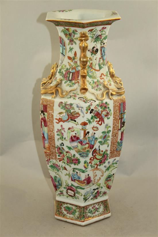 A Chinese Canton-decorated famille rose hexagonal baluster vase, mid 19th century, 44cm, slight restorations